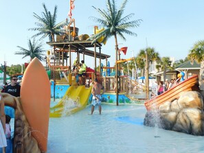 A water park with slides and a play structure.