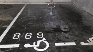 A parking garage with a handicap parking space marked with the international accessibility symbol. - Bright Duplex in Lille-Wazemmès (Lille)