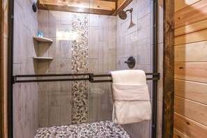 Combined shower/bathtub, hair dryer, towels, soap