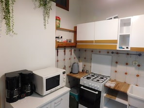 Fridge, microwave, stovetop, coffee/tea maker