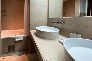 Bathtub, hair dryer, towels