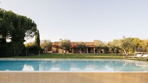 A swimming pool with a clear view of a building in the background.