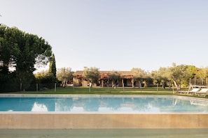 A swimming pool with a clear view of a building in the background.