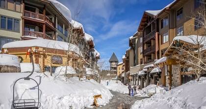 Ski-in/out condo with mountain view, private hot tub, deck & fireplace