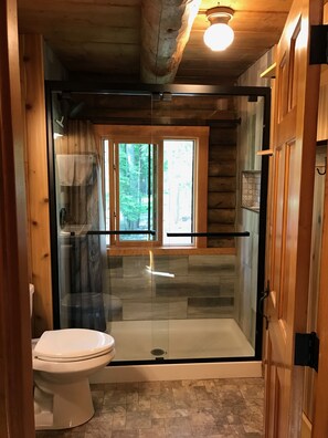 Shower, hair dryer, towels, toilet paper