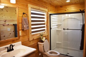 Shower, jetted tub, towels, soap