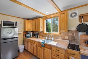 Fridge, microwave, stovetop, coffee/tea maker