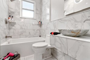 Combined shower/tub, hair dryer, towels, soap