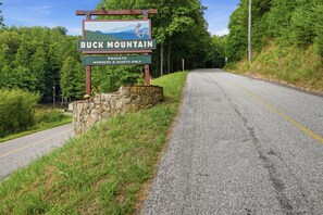 A sign for Buck Mountain indicating it is a private members and guests only area.
