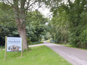 A sign welcoming visitors to Hardwick, a National Trust property.