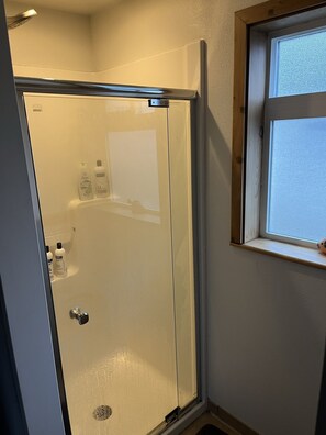 Shower, hair dryer, towels, soap