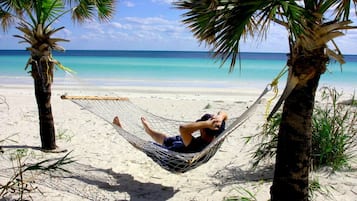 On the beach, sun-loungers, beach towels