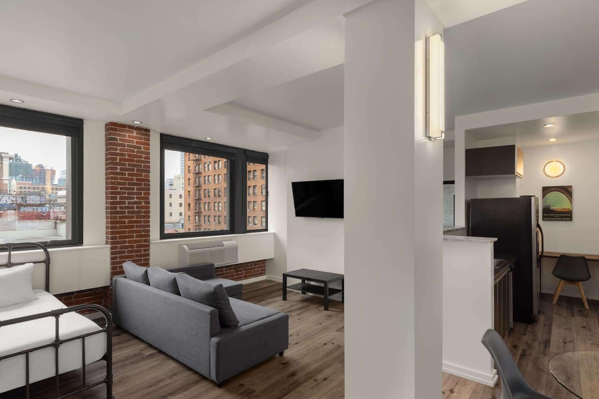 Suite, Multiple Beds, Non Smoking (Group) | Iron/ironing board, free WiFi, bed sheets