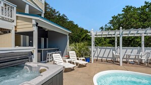 A pool area with a hot tub, lounge chairs, and a pergola. - Shell's Shack: Oceanside, Private Pool, Hot Tub, Tiki Bar, Putting Green (Corolla)