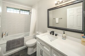 Combined shower/tub, hair dryer, towels, soap