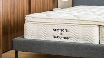 A mattress with a quilted pattern and the text "SECTION X BoConcept".