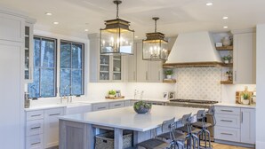 A spacious kitchen with a large island, pendant lighting, and ample storage. - OVERLOOK HAUS- Mountain Oasis Overlooking San Sophia’s Ridge, Fire Pit & Hot Tub (Mountain Village)