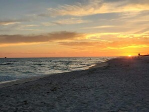 A beach with a sunset in the background. - Beachview 216 (Gulf Shores)