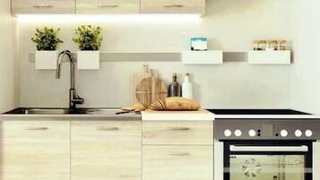 Fridge, stovetop, coffee/tea maker, cookware/dishes/utensils