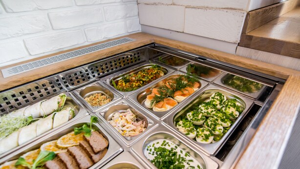 A buffet with various food options including salads, meats, and seafood. - Dworek Pani Walewska (Gdansk)