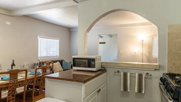 Fridge, microwave, coffee/tea maker, cookware/dishes/utensils