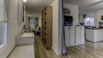 Fridge, microwave, coffee/tea maker, cookware/dishes/utensils