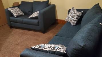 Apartment (Cozy 2-bedroom in Cleveland) | Living room | TV