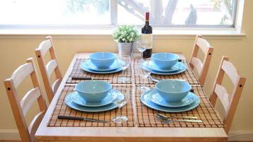 Fridge, microwave, coffee/tea maker, cookware/dishes/utensils