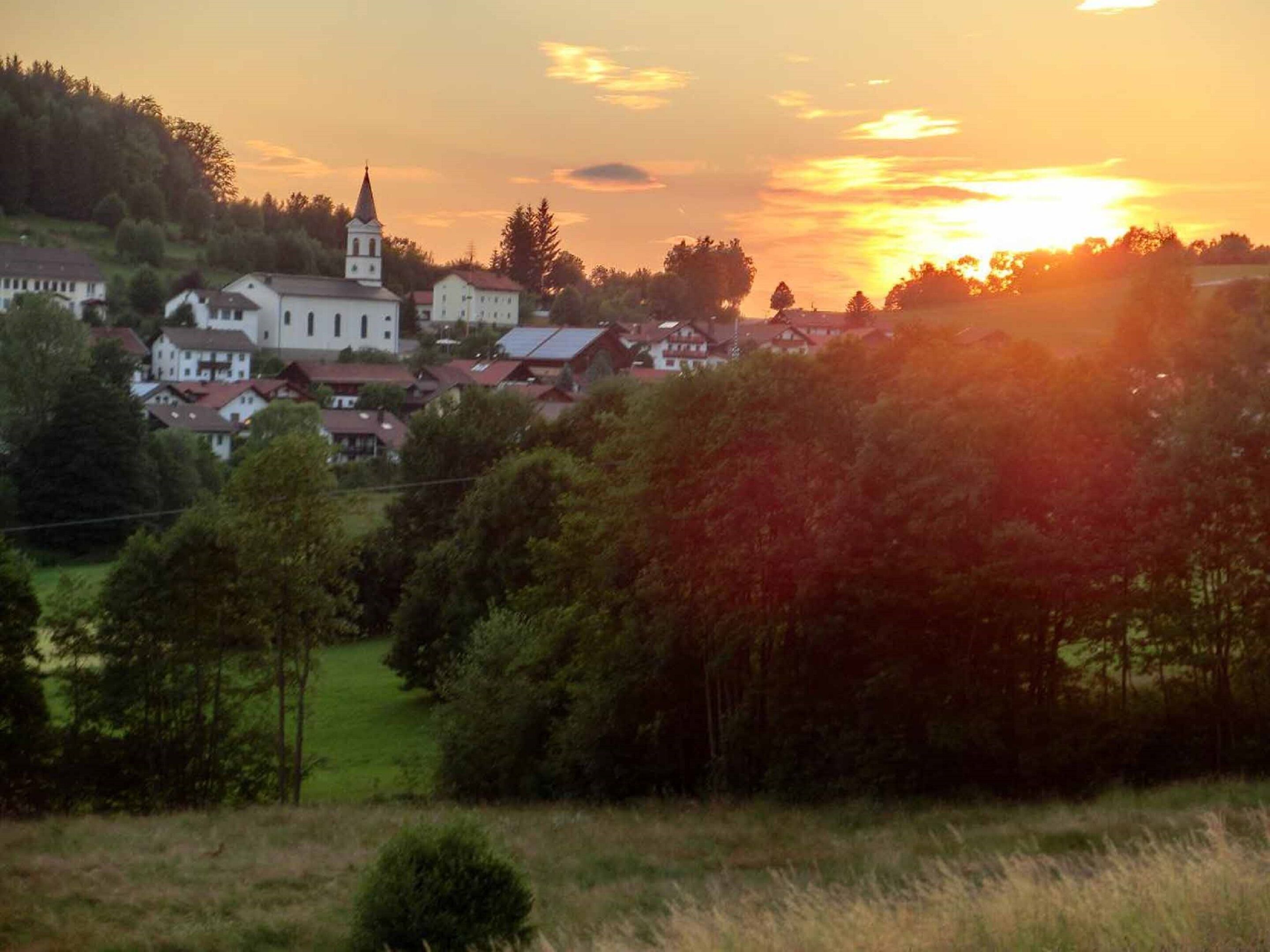 A village with a prominent church and residential buildings.