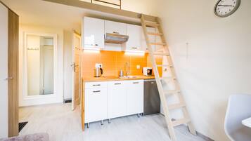 Economy Studio Suite | Private kitchen | Fridge, stovetop, coffee/tea maker, electric kettle