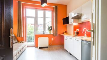 Economy Studio Suite | Living area | 42-inch Smart TV with digital channels, TV