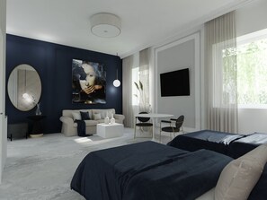 A modern bedroom with a large bed, a sofa, a desk, and a TV.