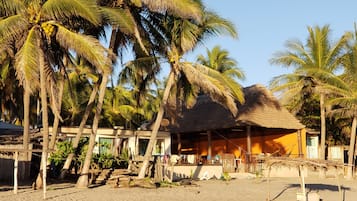 On the beach, sun-loungers