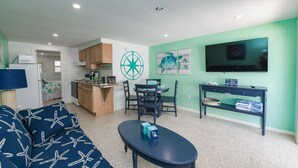 Room, 1 King Bed with Sofa bed, Kitchen, Garden View | Living room - Cabin at Captain's Quarters (Bradenton Beach)