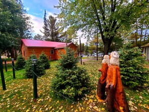 Surrounded by a serene garden, this secluded cabin offers a peaceful retreat.