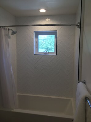 Combined shower/bathtub, hair dryer, towels, soap - Modern Downtown Getaway - Walk Everywhere (Bozeman)
