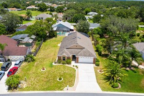 Stunning single-family homes with diverse architectural styles and beautifully manicured lawns.