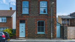 A two-story brick house with a white door and blue-framed windows. - Fig Tree House, Deal, Kent (Deal)