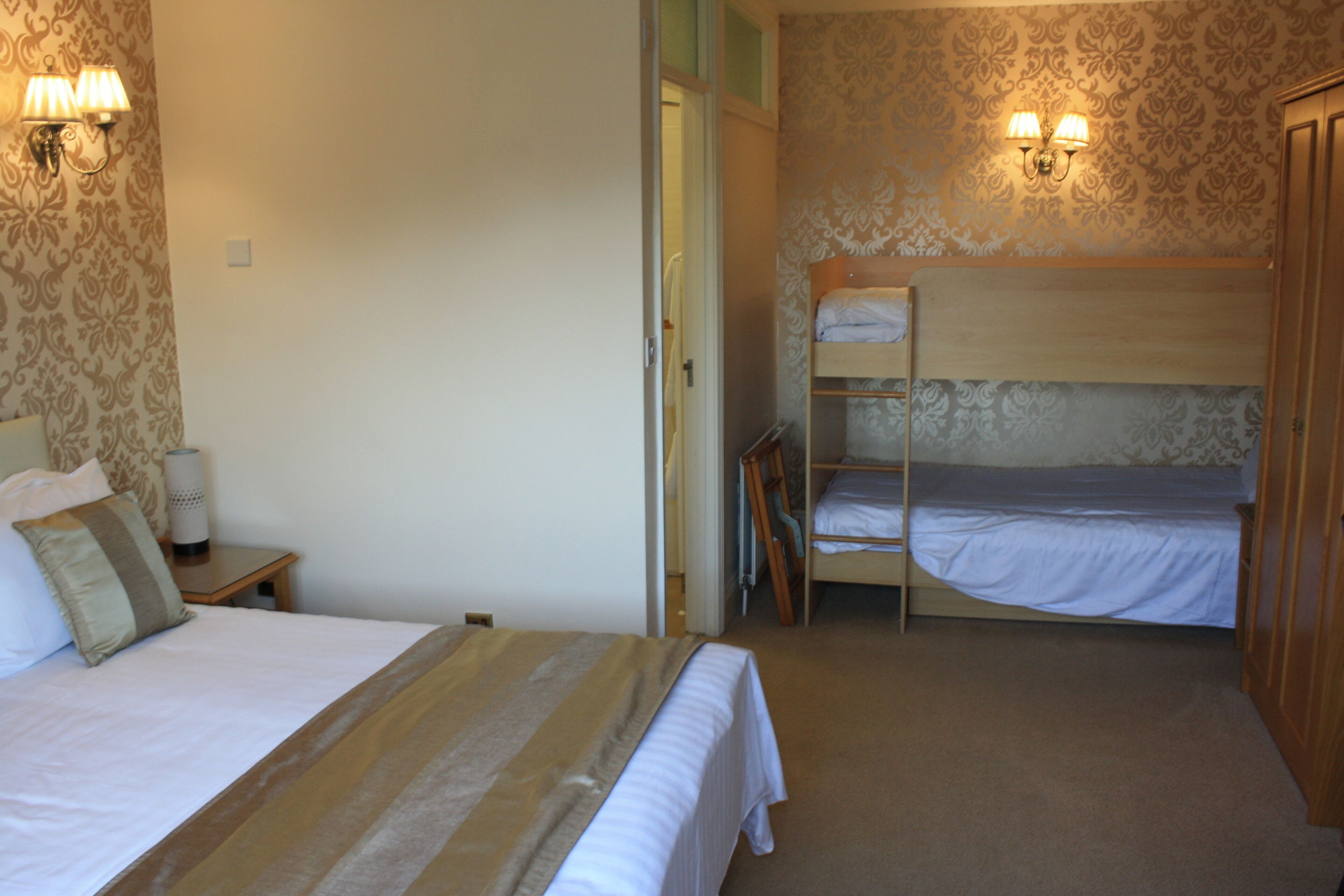 family room | desk, laptop workspace, blackout curtains, iron/ironing board