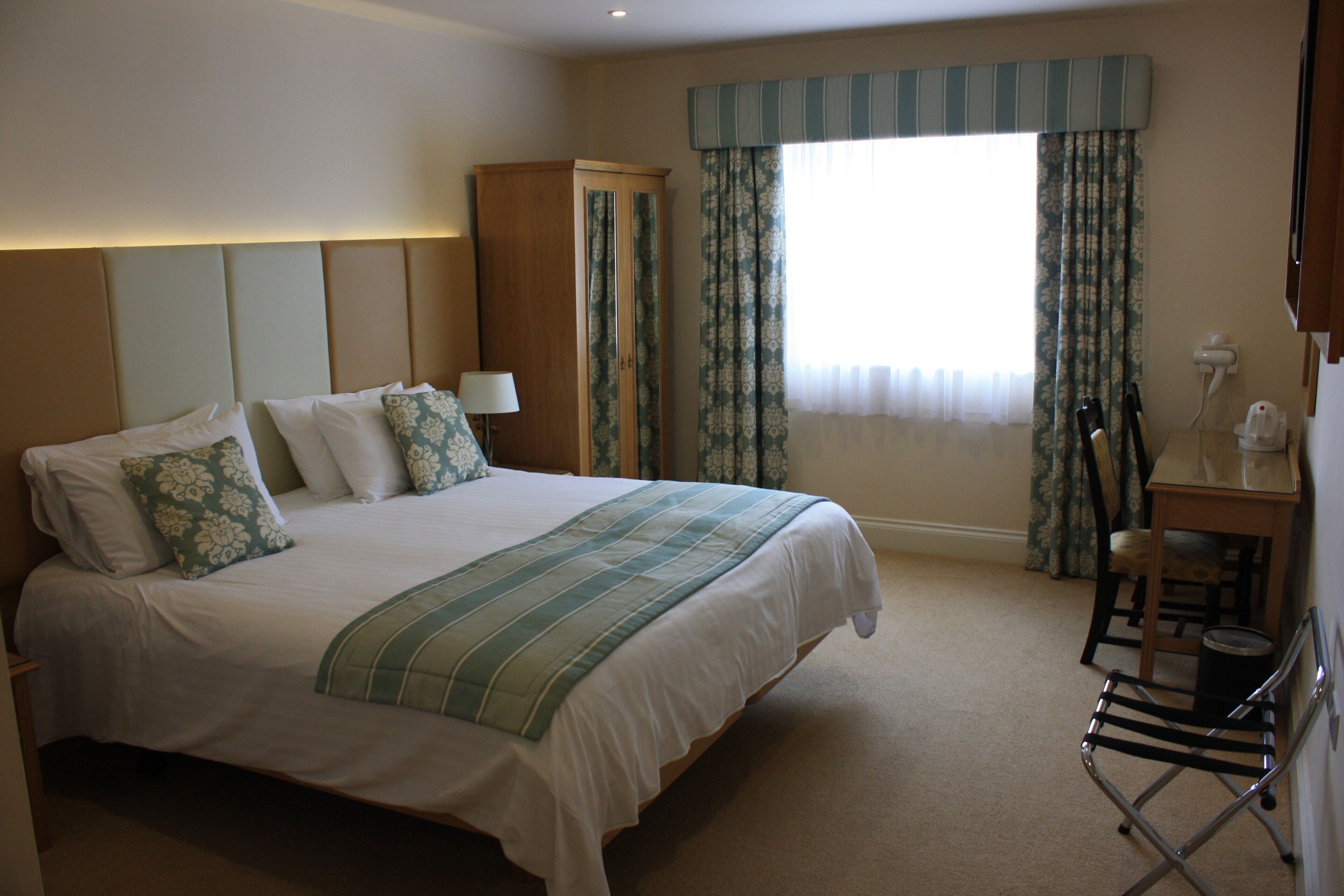 deluxe room, 1 king bed, accessible | desk, laptop workspace, blackout curtains, iron/ironing board