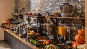 A buffet with various food items and beverages, including fruits, vegetables, and a cake. - Villa Sonia by Estia Adults Only (Hersonissos)