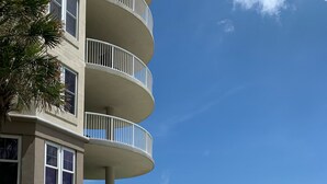 A pool area with a sign indicating no lifeguard, pool rules, and no diving. - Luxury 5th Floor Oceanfront Condo next to Ritz Carlton! (Fernandina Beach)