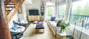 mbrace nature in this bright home that has gorgeous views to the lake and forest