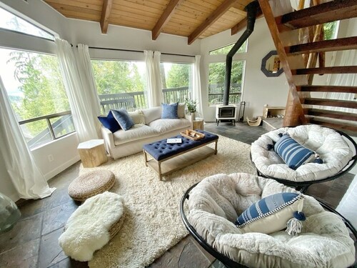 mbrace nature in this bright home that has gorgeous views to the lake and forest