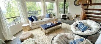 mbrace nature in this bright home that has gorgeous views to the lake and forest