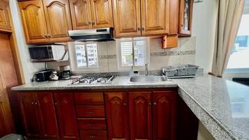 Fridge, microwave, stovetop, coffee/tea maker