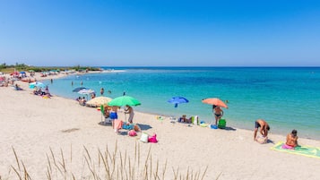On the beach, sun loungers