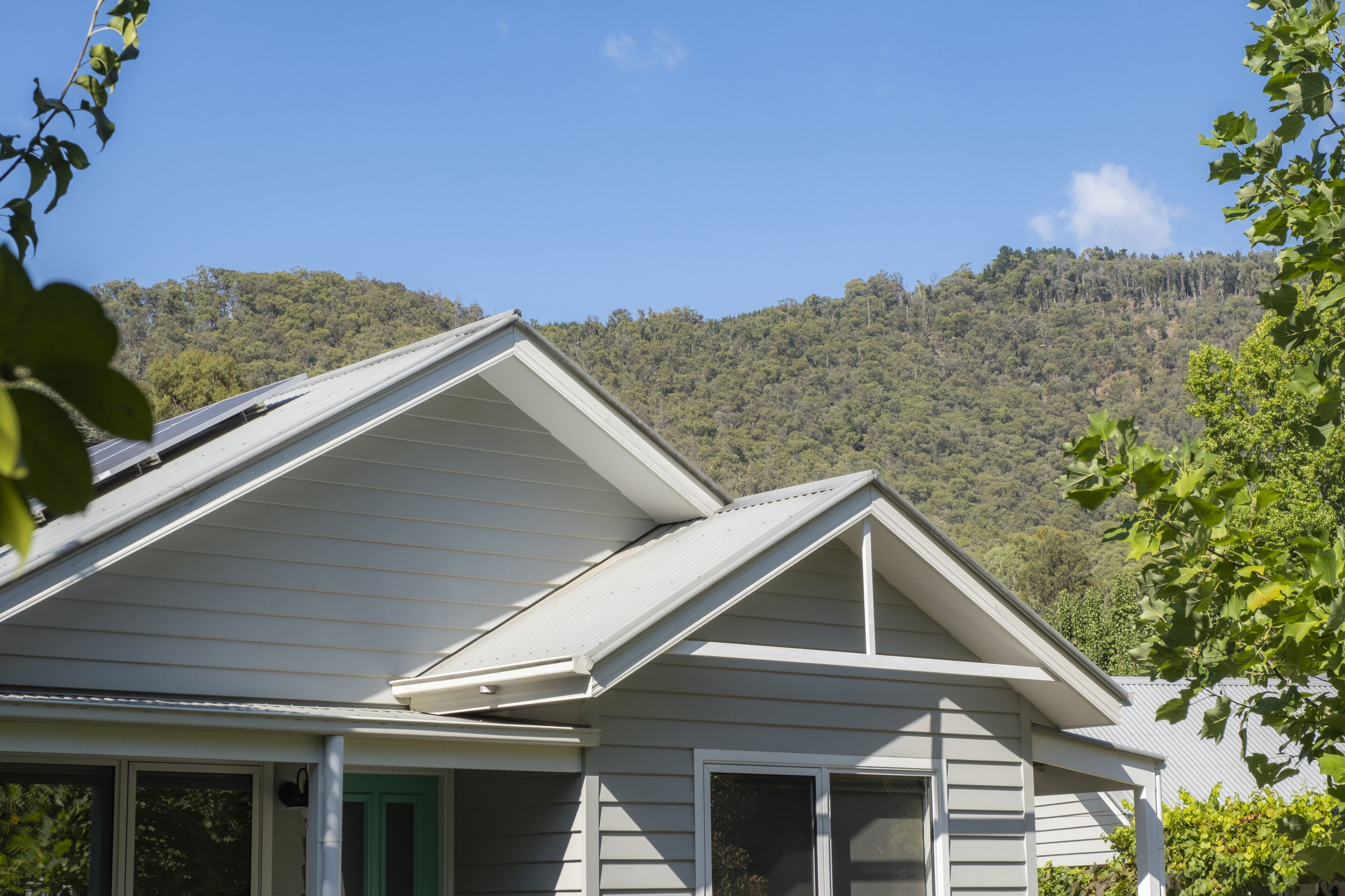 A house with a gabled roof and a porch.