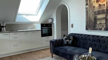 Studio | Living area | 42-inch TV with satellite channels