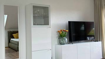 Studio | Living area | 42-inch TV with satellite channels